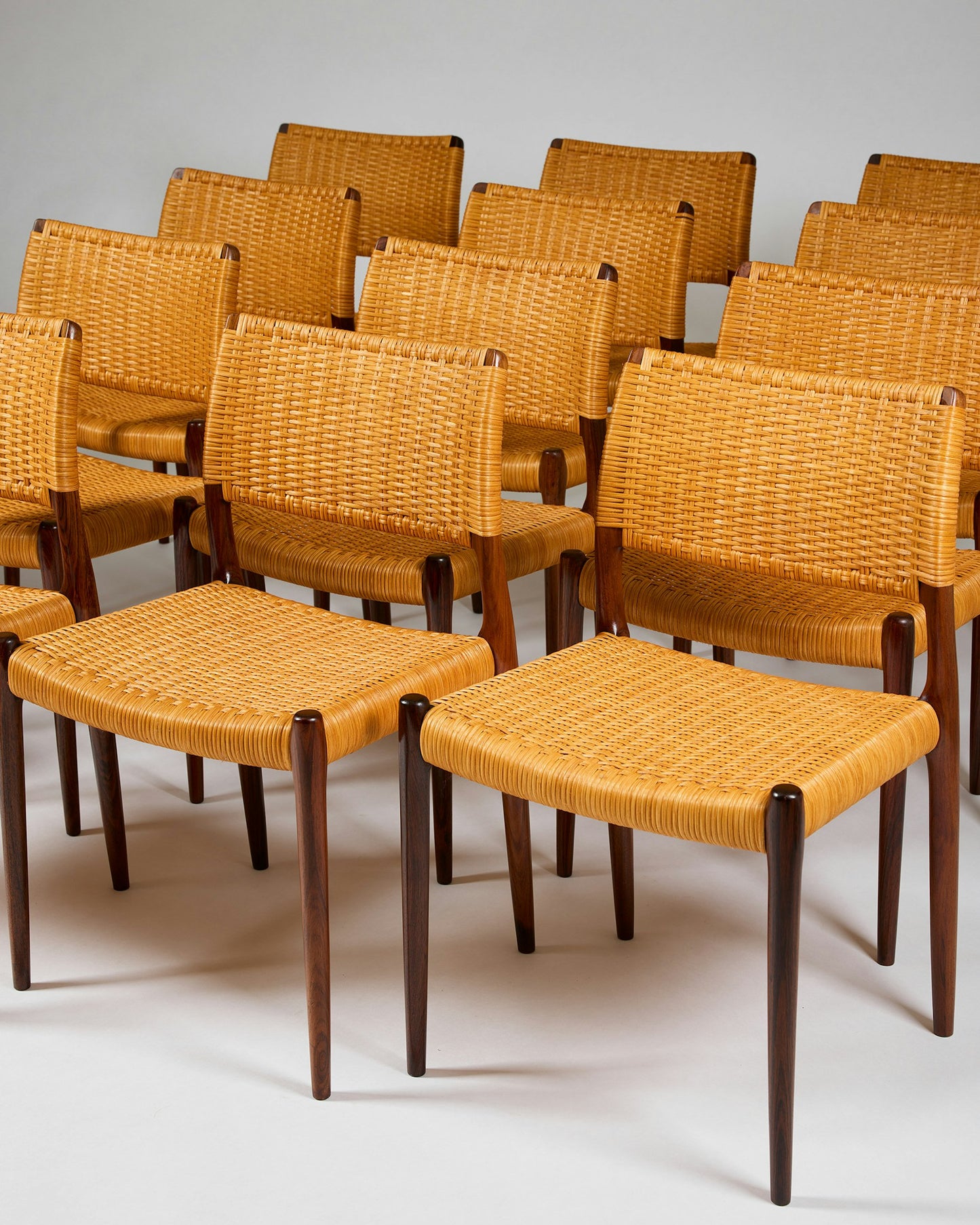 Set of fourteen dining chairs