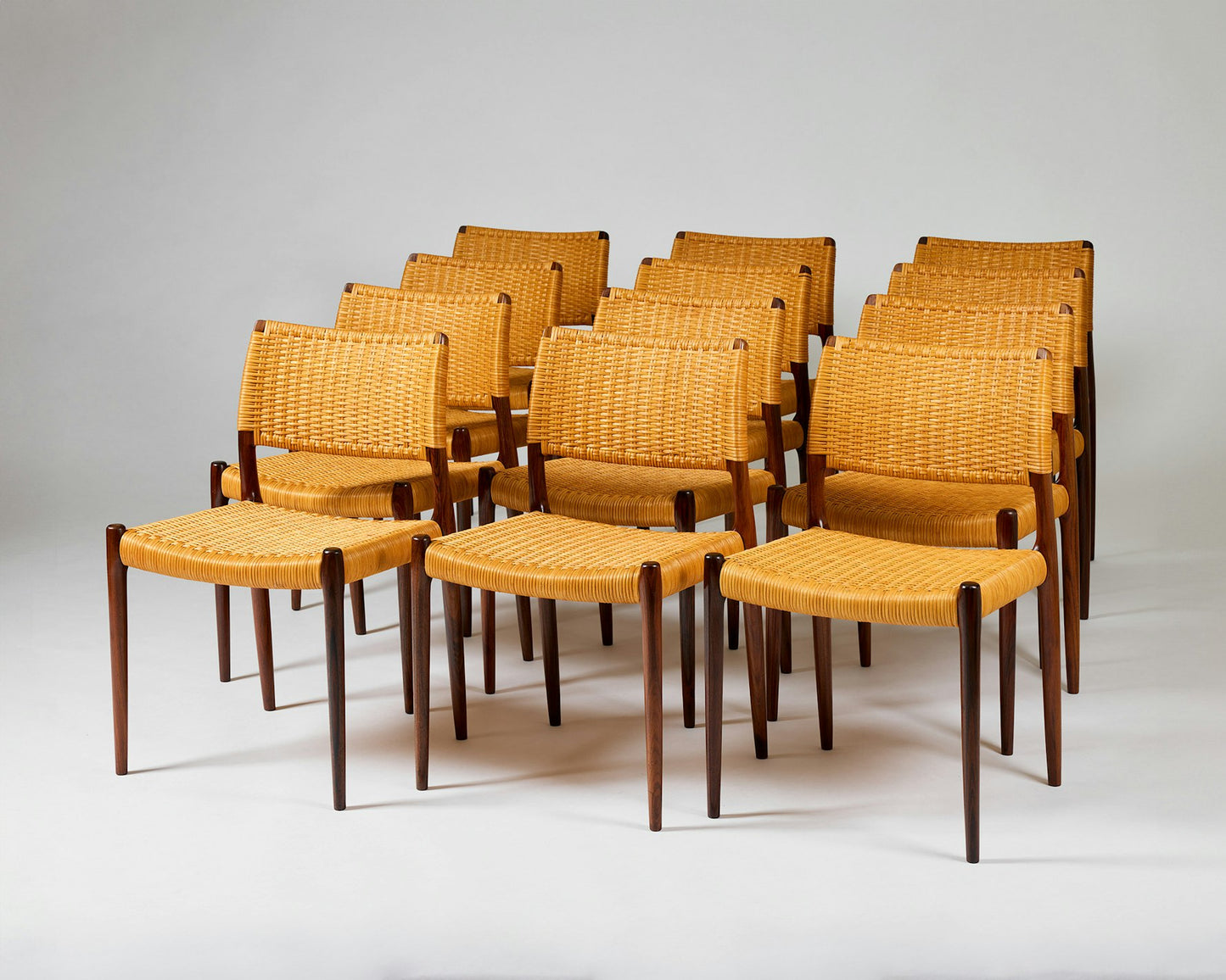 Set of fourteen dining chairs