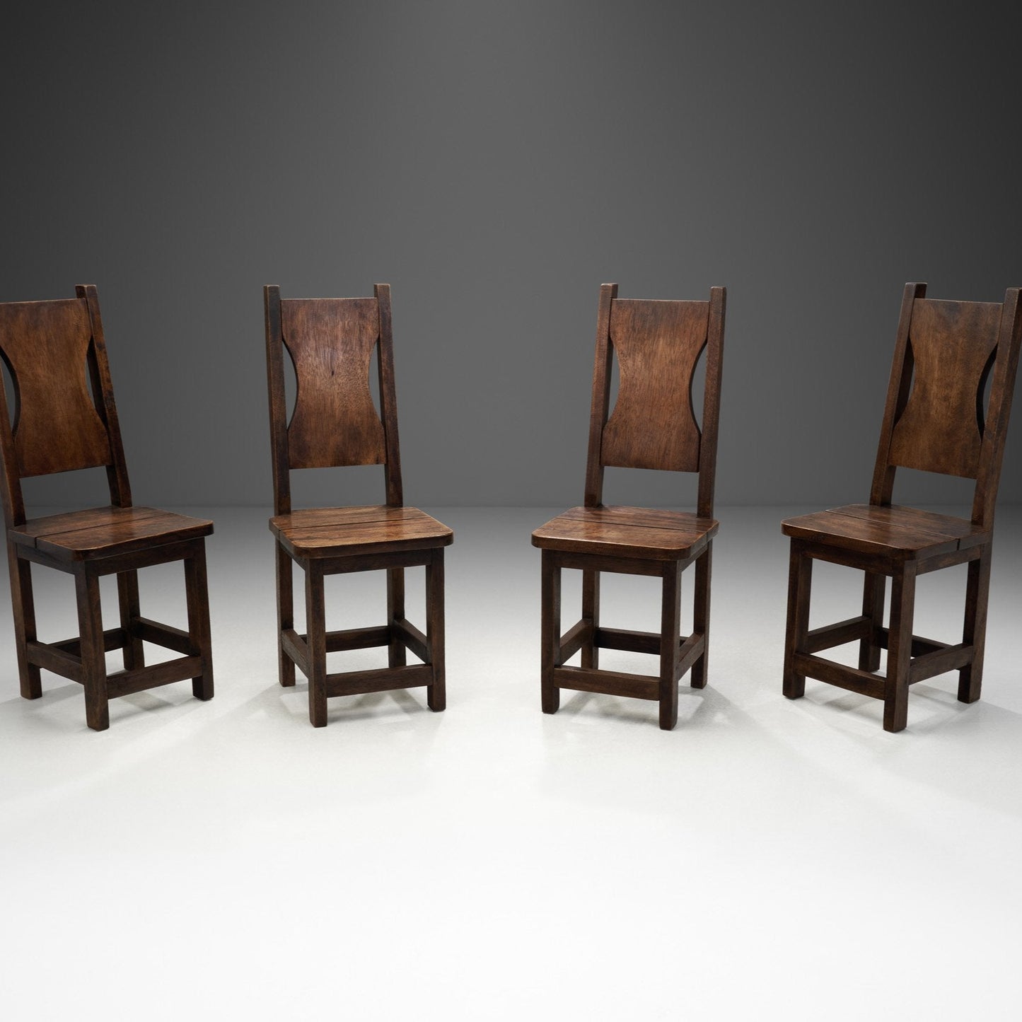 A Set of Four Stained Beech Modernist Dining Chairs, France 1950s