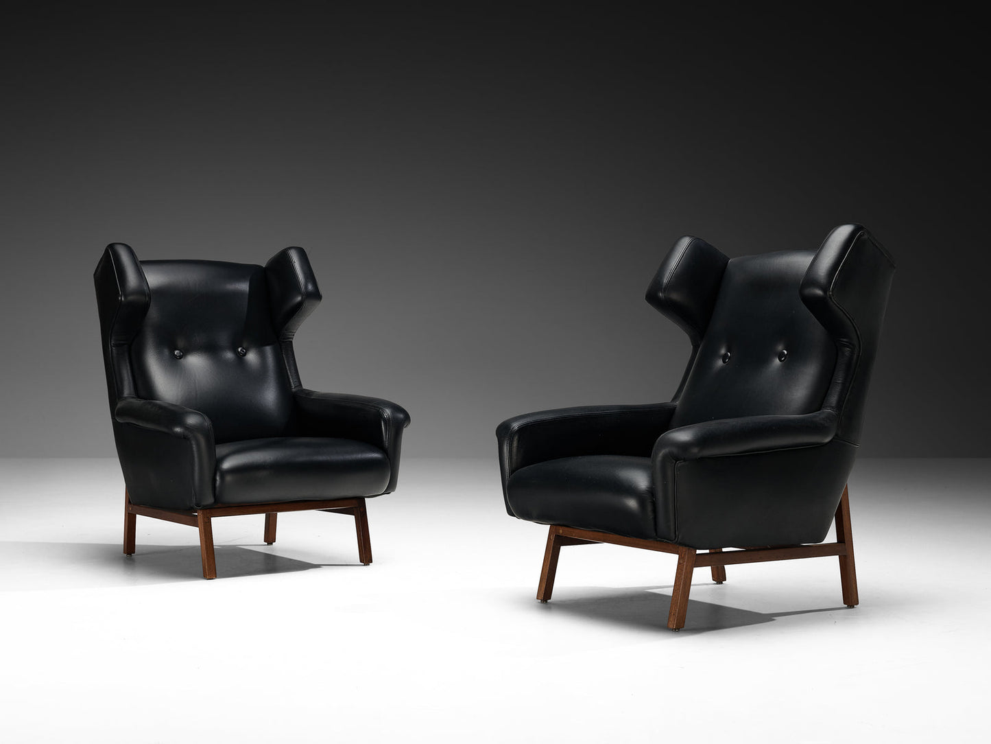 Italian Pair of Wingback Lounge Chairs in Black Leather and Mahogany