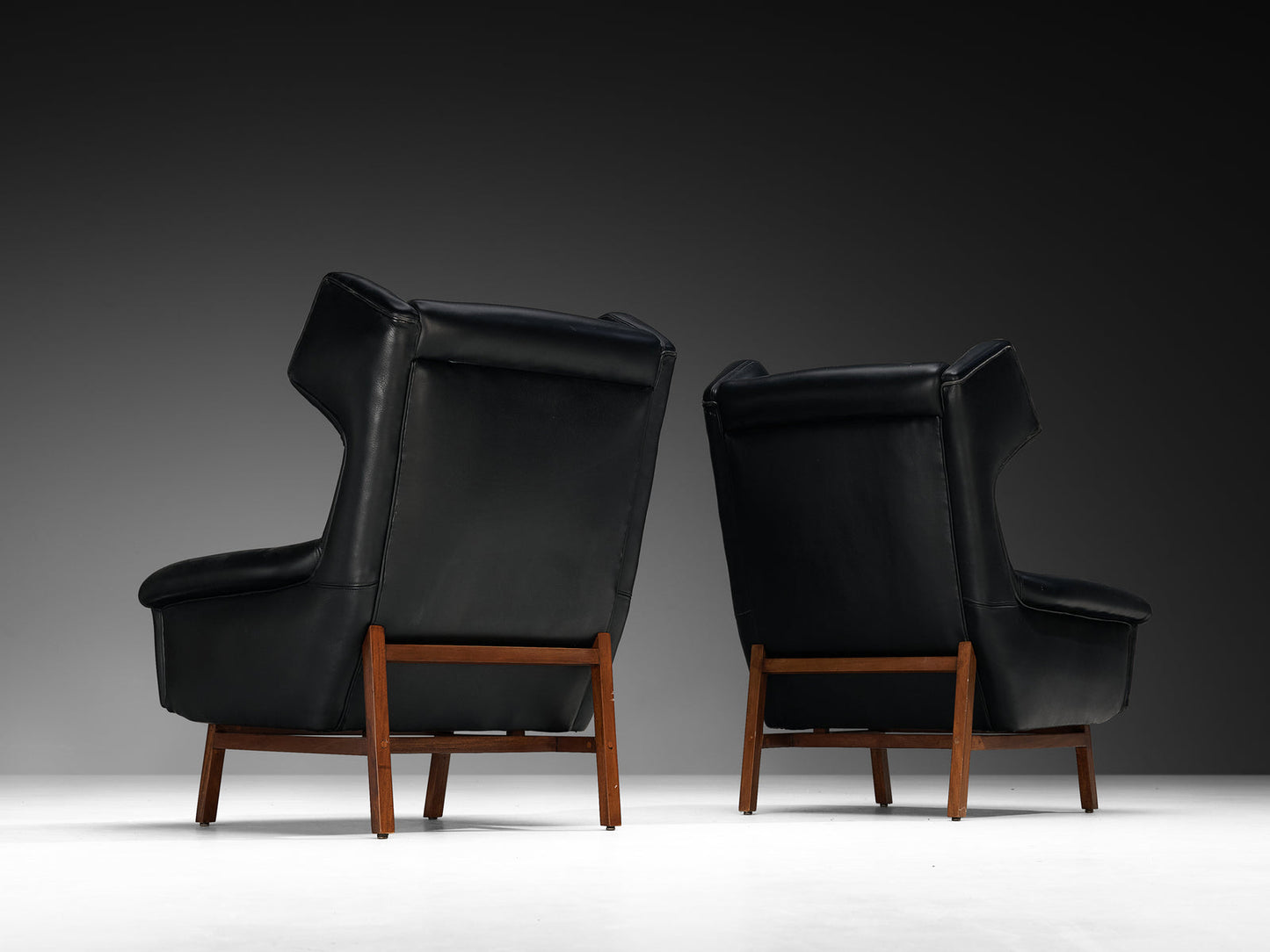 Italian Pair of Wingback Lounge Chairs in Black Leather and Mahogany