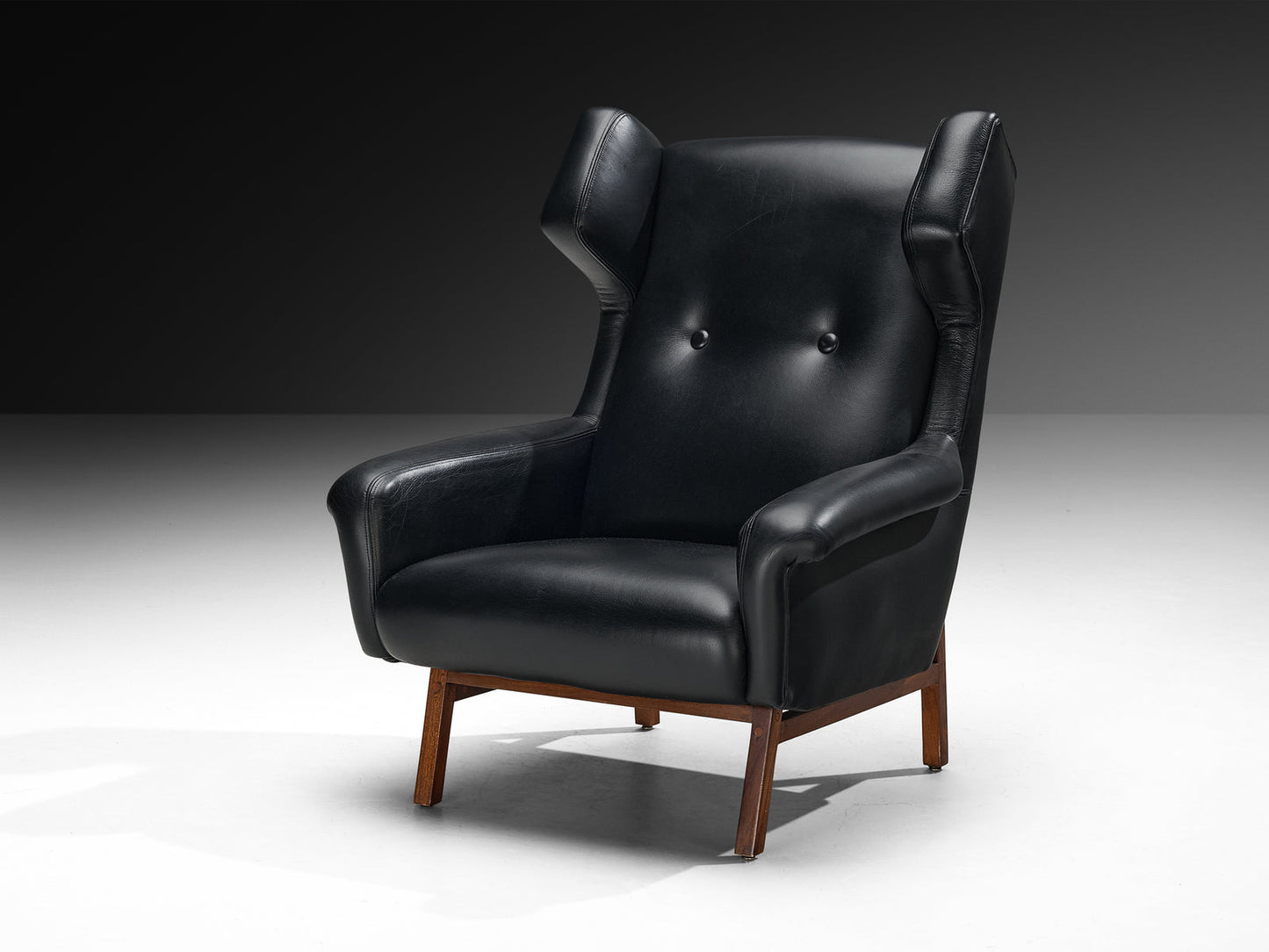 Italian Pair of Wingback Lounge Chairs in Black Leather and Mahogany
