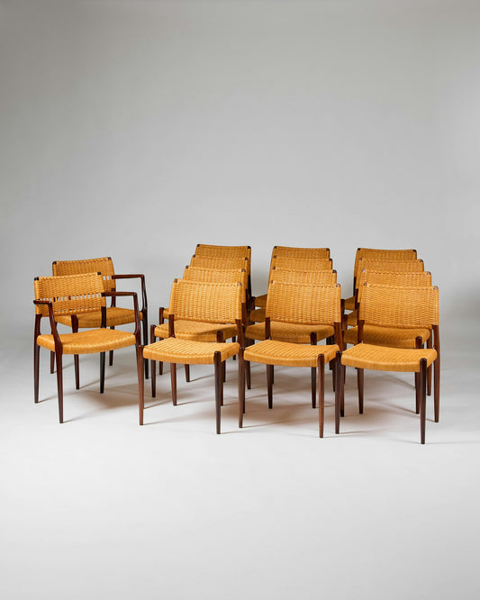 Set of fourteen dining chairs
