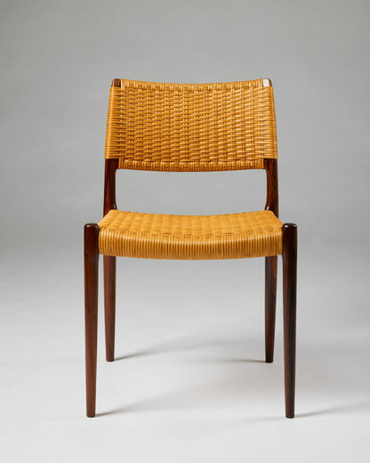 Set of fourteen dining chairs