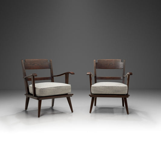 Pair of Dark Stained Pine Armchairs, Europe First half of the 20th century