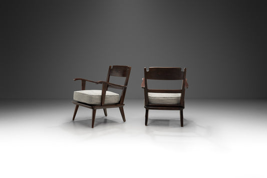 Pair of Dark Stained Pine Armchairs, Europe First half of the 20th century